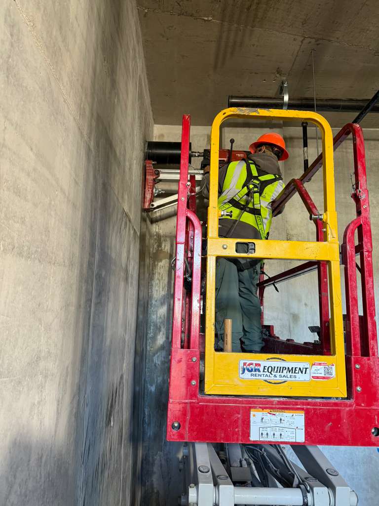 Technician performing GPR scan in residential construction