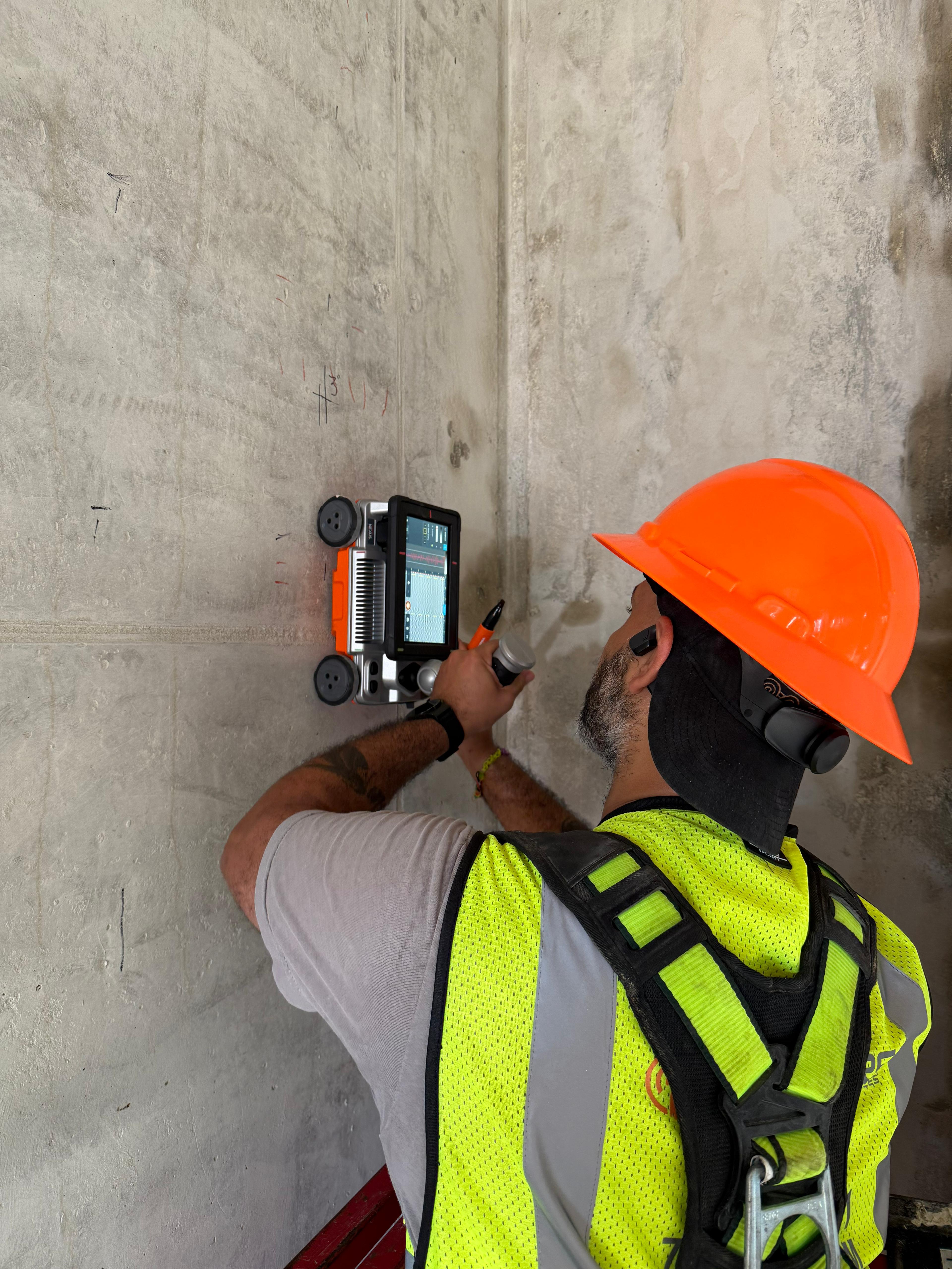 Marked concrete wall showing planned core drilling location