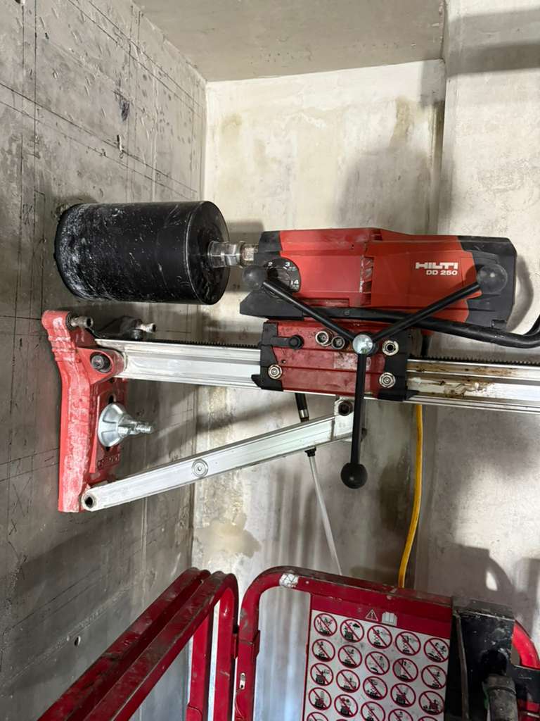 Hilti concrete coring drill mounted on wall