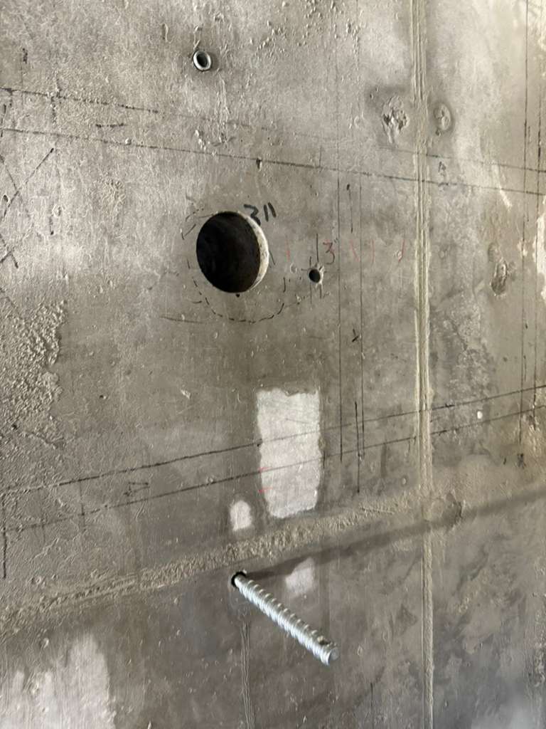 Completed concrete core hole in wall