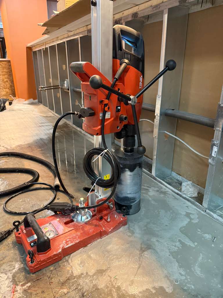 Concrete coring equipment setup for vertical drilling